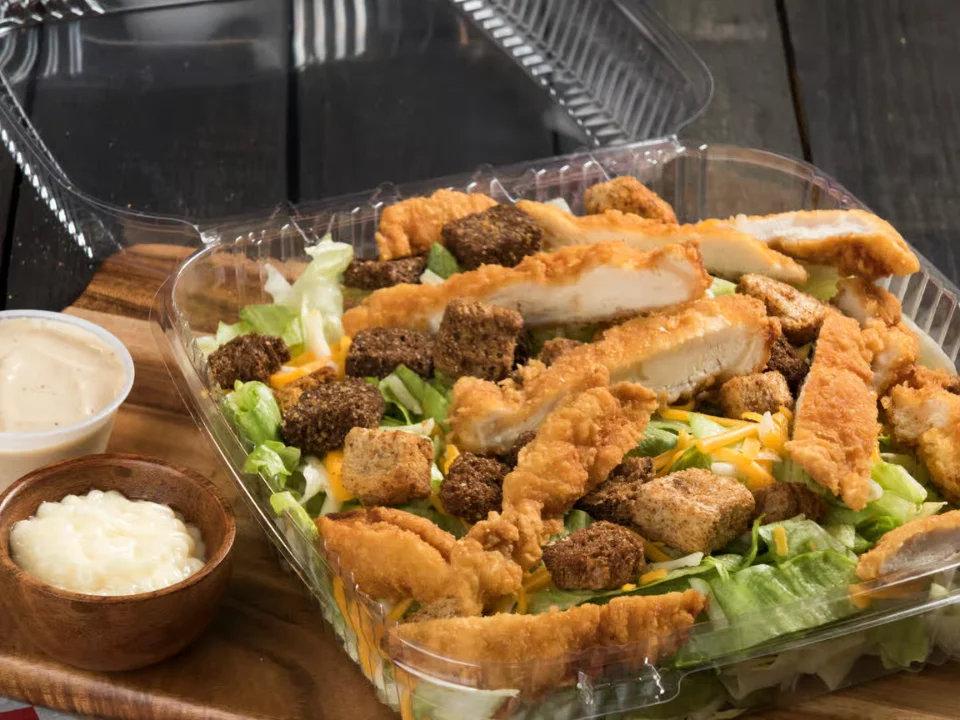 Chicken Caesar Salad - Crisp romaine with grilled chicken and Caesar dressing